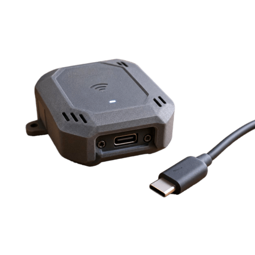 Spectr node — a small plug-in presence sensor with a USB-C cable